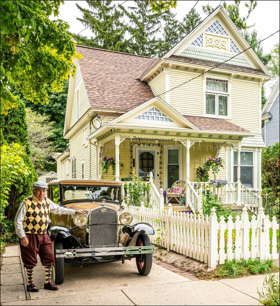 The Barns Into Birdhouses office shown with a classic car in the driveway.